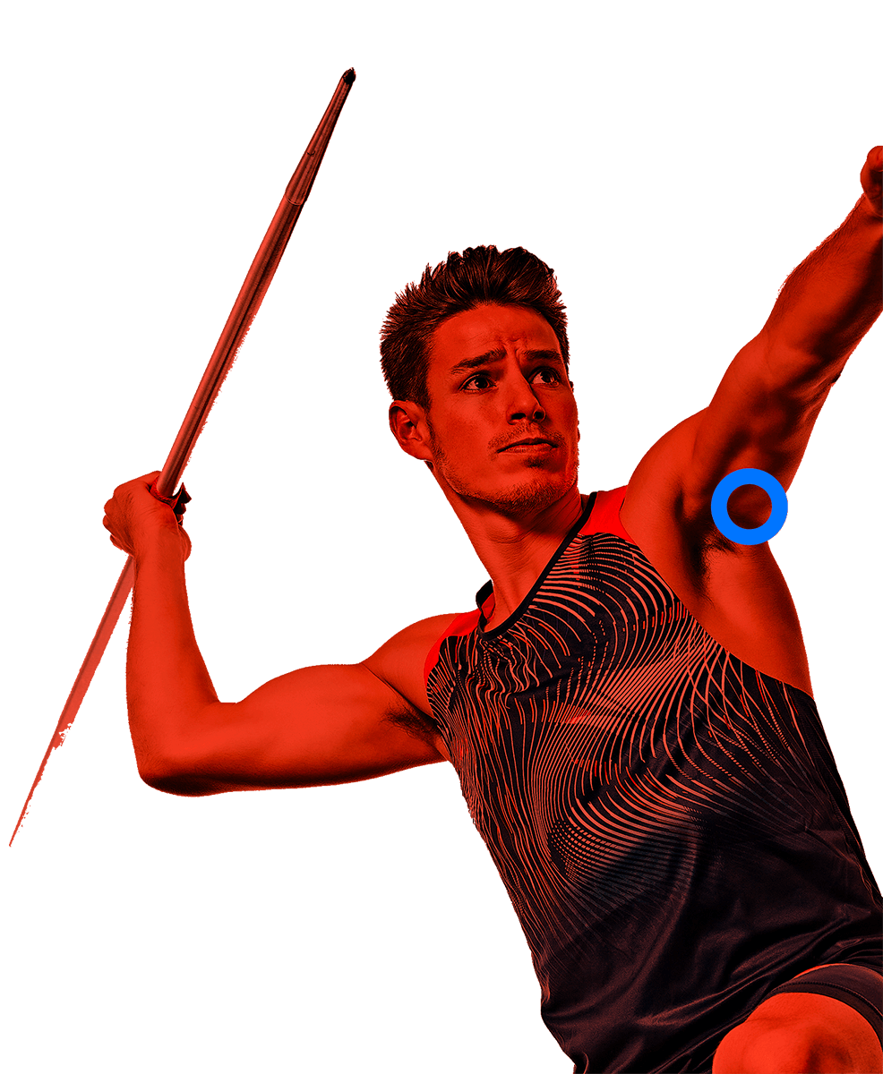 In the picture, a male athlete extends their arms to throw a javelin